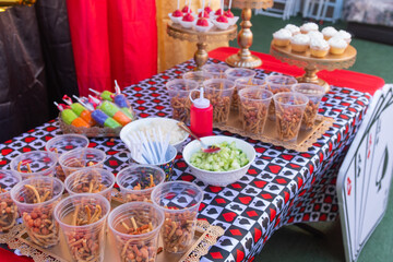 Candy table at a party with sweet desserts