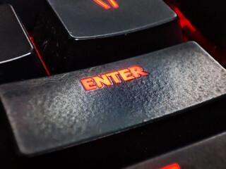 Enter Key on a keyboard glowing in red colour