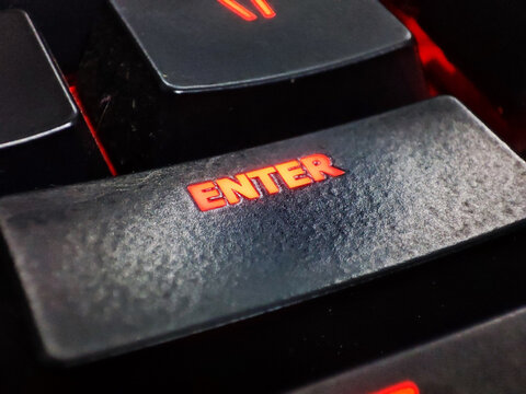 Enter Key on a keyboard glowing in red colour