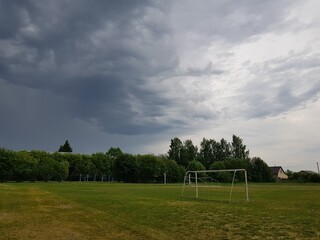Dark storm clouds over the football field