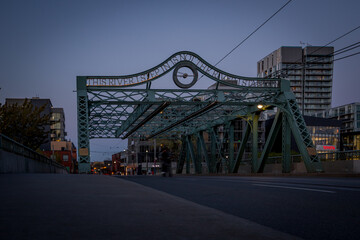 Fototapeta na wymiar Old steel road bridge in evening time. Don valley, Toronto, Ontario