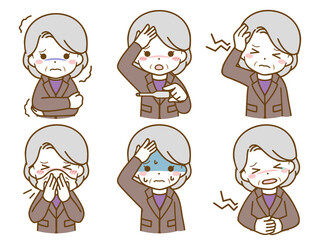 体調の悪いスーツを着た高齢女性