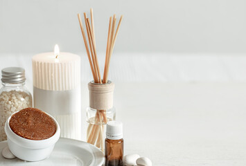 Spa composition with aroma sticks, aroma oil and scrub copy space.