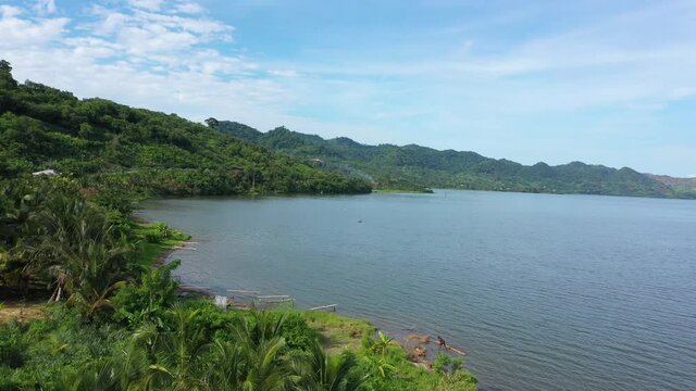 Aerial Lake Bosomtwe shore Kumasi Ghana Africa part 2. Only natural lake in Ghana. It is situated within an ancient impact crater. A sacred lake in traditional beliefs. Tourist resorts and fishing.