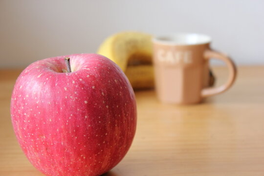 picture of apple with banana and espresso cup