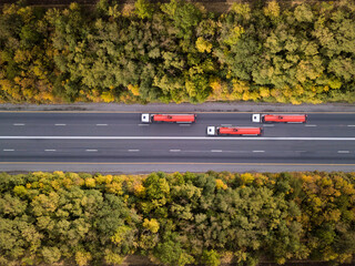Aerial top down shot of highway with truck trailer and the car. Rostov region. Russia.