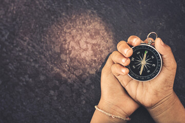 The compass of a traveler who is traveling on the road.