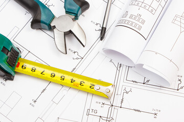 Work tools, electric fuse and diagrams of plan with electrical installation. Building home