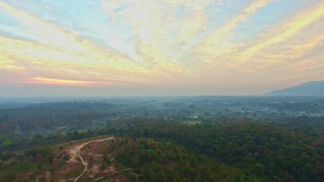 .aerial photography beautiful sunrise above rural village in Chiang Mia province. .colorful cloud background.4K resolution..