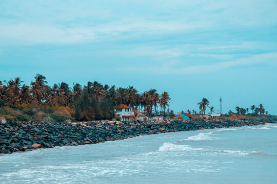 PONDICHERRY, INDIA - July 14:Yacht at the sea in. Aerial view of harbour at sunset. Colorful landscape with stone rocks, blue sea. Top view from drone of Harbour