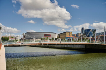 Nervion river and Frank Gehry bridge with the Athletic club de Bilbao Football Stadium (San Mames), Bilbao
