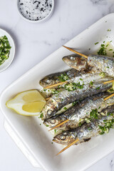 Homemade Grilled Sardines with Garlic, Olive Oil, Fresh Parsley, and Lemon