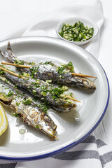 Homemade Grilled Sardines with Garlic, Olive Oil, Fresh Parsley, and Lemon