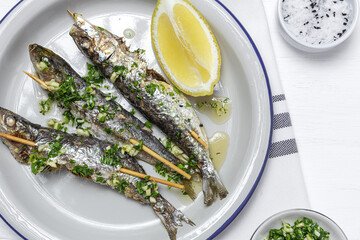 Homemade Grilled Sardines with Garlic, Olive Oil, Fresh Parsley, and Lemon