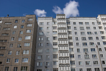 Fototapeta premium View from below on the facade of a modern multi-storey building with beautiful balconies