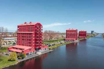 Foto auf Leinwand Modern architecture in Almere, the "Rode Donders" (red devils) appartment buildings in the colorful neighborhood "Regenboogbuurt" in Almere Buiten © Pavlo Glazkov