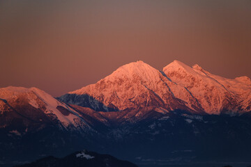 Fototapeta na wymiar Kamnik-Savinja alps in Slovenia in red sunset