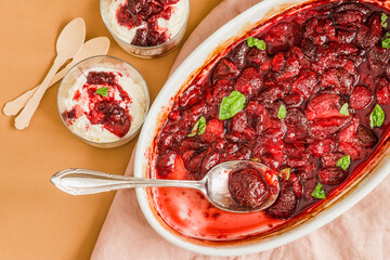 Strawberry fruits oven baked with ice cream, jam sauce.