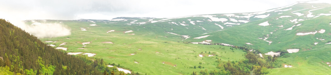 Fototapeta na wymiar Panorama of the Lago-Naki plateau with stripes of winter snow