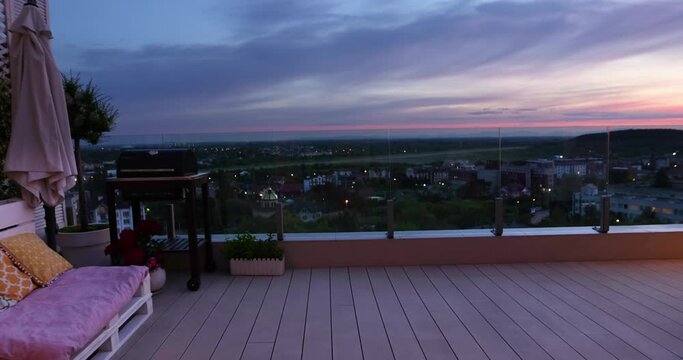 view on beautiful sunset from cozy rooftop patio