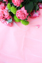 mockup greeting card. bouquet of pink roses on a pink background and space for text 