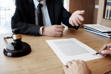 Lawyer discuss the contract and legal document agreement in office. Law and legal concept