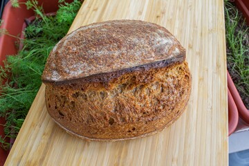 loaf of fresh bread on a wooden board