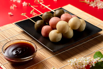 Japanese Dango multicolor dessert wirh sweet soy sauce.