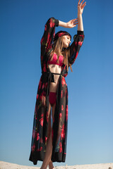 Beautiful woman wearing summer clothes on the beach