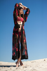 Fototapeta premium Beautiful woman wearing summer clothes on the beach
