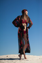 Beautiful woman wearing summer clothes on the beach