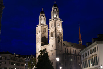 Fototapeta na wymiar Church Grossmünster (Great Minster) at the old town of Zurich at night at summertime. Photo taken June 5th, 2021, Zurich, Switzerland.