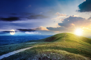 day and night time change concept above the mountain landscape in summer. path through meadow in...