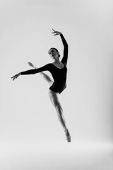 Fototapeta na wymiar Young ballet dancer isolated on white background