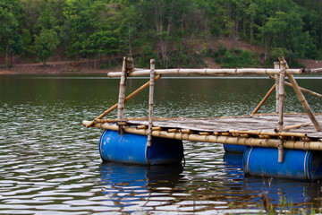 Fototapeta premium Raft made from bamboo and plastic bags use of natural materials combined with recycled materials to reduce waste and pollution of the world