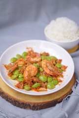 Stir fried Sato and shrimp with curry paste (thai food) in white dish put

