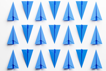 Set of blue paper airplanes on white background. Repeating pattern. 3d render - 437672675