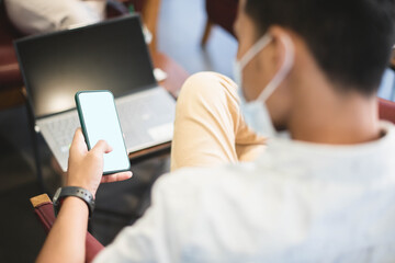 smart man working on his smart phone without going into the office It is working through social communication.