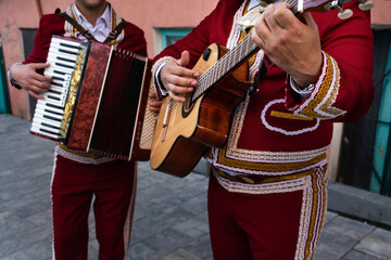 Musicians on the city street at sunset. Latin American music.