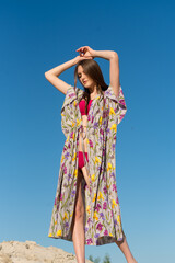 Portrait of Beautiful young woman wearing a colorfull sarong and bikini on the tropical beach