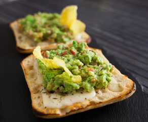 morning toast with melted cheese and guacamol