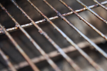 Empty dirty grill rust from front top. Closeup. Detail.