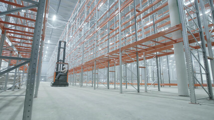 Loader moving in modern and bright warehouse