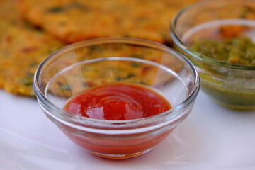 Tomato ketchup or sauce served in a glass bowl