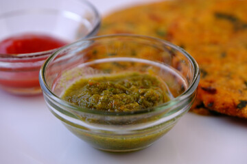 Green Mint Chutney Made with Coriander, pudina And Spices.