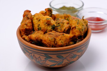 Indian snack pakora with tomato sauce or chutney