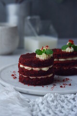 red velvet cake with cream cheese frosting on the table