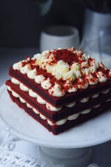 red velvet cake with cream cheese frosting on the table