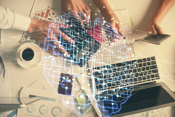 Double exposure of man and woman working together and human brain hologram drawing. Brainstorm...