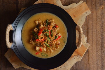 a bowl of tempeh cooked in coconut milk and spices named jangan ndeso in Bahasa